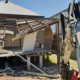 Demolishing part of 17 Stafford street, East Brisbane.